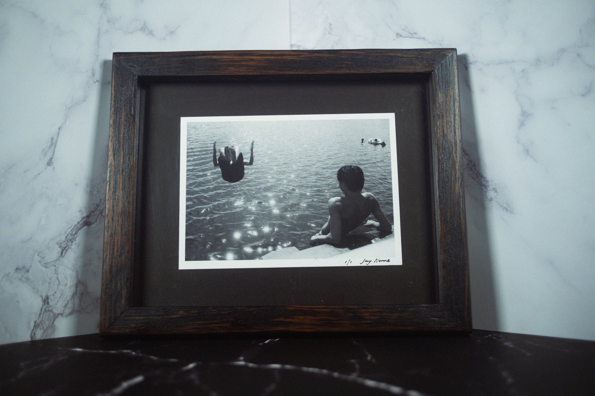 Framed Black and White Print of boys jumping of narrabeen bridge shot with kodak double x